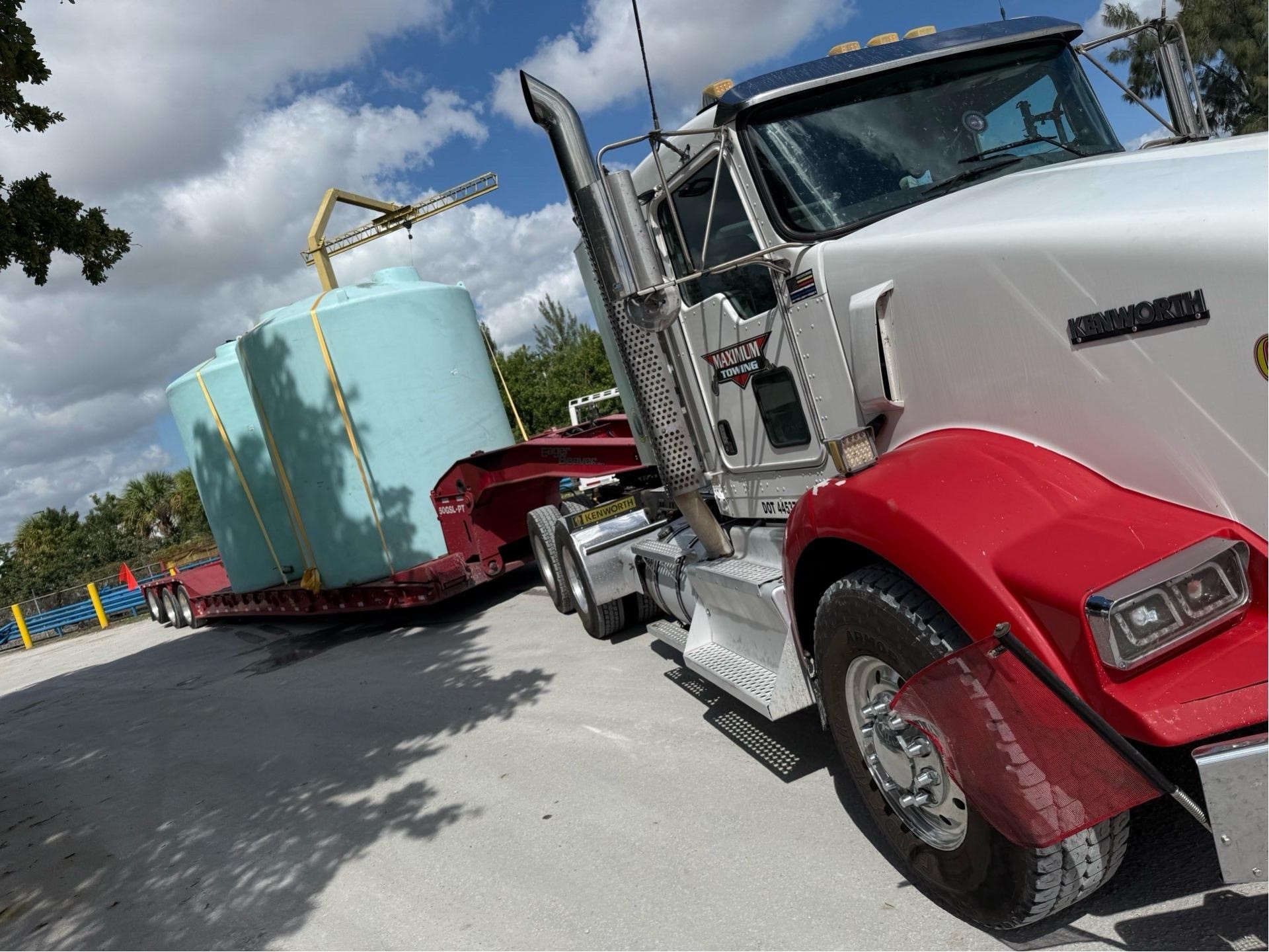 oversized tanks on 50ton lowboy trailer – heavy equipment transport Central Florida | Maximum Towing