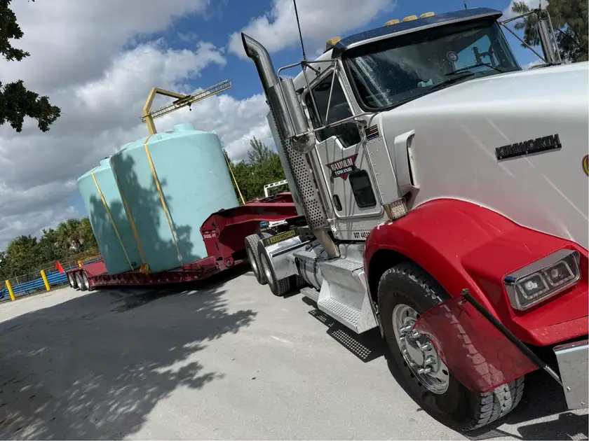 oversized tanks on 50ton lowboy trailer – heavy equipment transport Central Florida | Maximum Towing